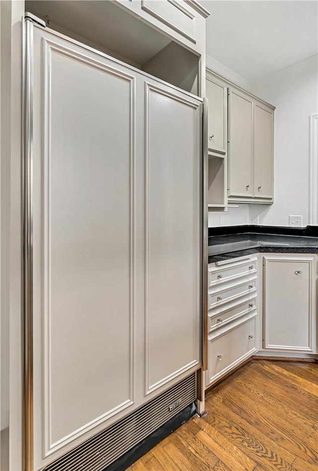 3720 Herwol Ave, Waco, TX 76710 - kitchen featuring dark countertops and dark wood finished floors