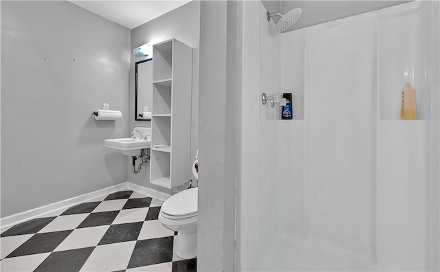 3720 Herwol Ave, Waco, TX 76710 - bathroom with tile patterned floors, baseboards, toilet, and a shower