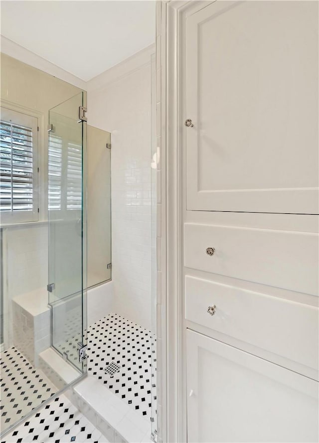 3720 Herwol Ave, Waco, TX 76710 - bathroom with tile patterned floors, a shower stall, and ornamental molding