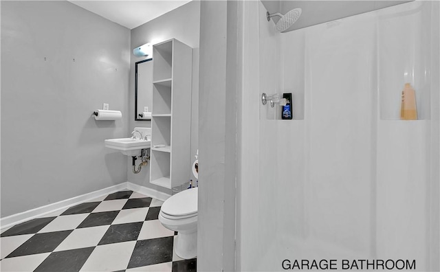 3720 Herwol Ave, Waco, TX 76710 - bathroom featuring tile patterned floors, toilet, a shower, and baseboards