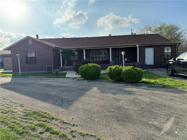 ranch-style house with brick siding