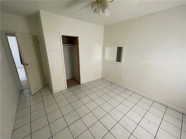 unfurnished bedroom with a closet and a ceiling fan