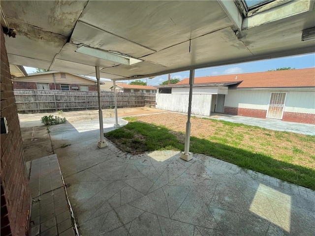 view of patio / terrace featuring fence