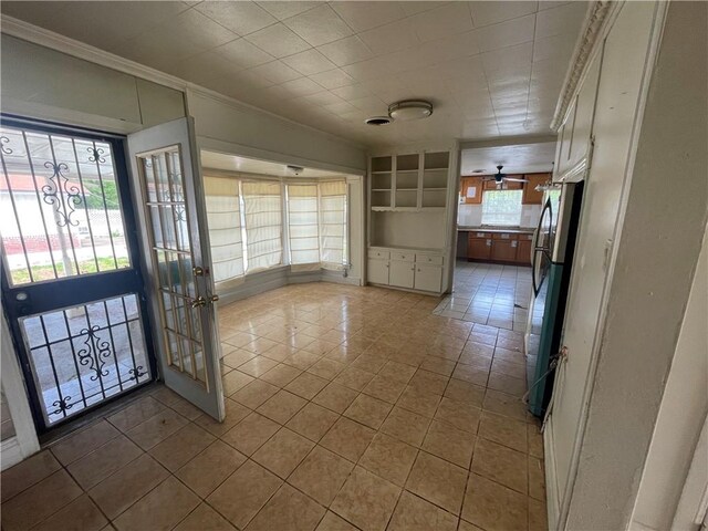 tiled entryway with crown molding