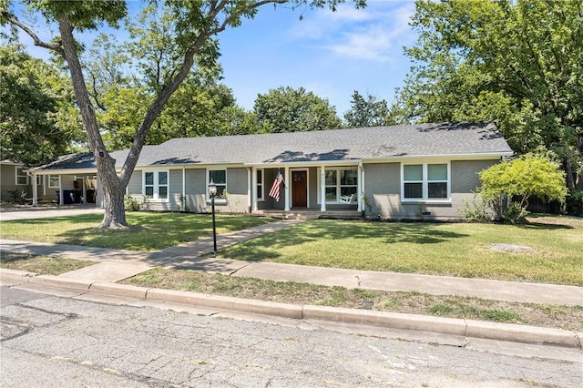 4007 Austin Ave, Waco, TX 76710 - single story home with a front lawn, brick siding, and a porch