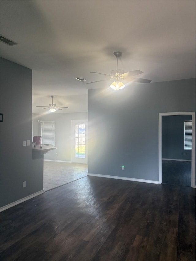 105 Wildcat Dr, Waco, TX 76705 - spare room with ceiling fan, dark wood-style flooring, and baseboards