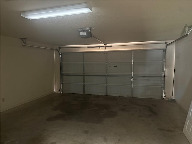 105 Wildcat Dr, Waco, TX 76705 - garage featuring a garage door opener and baseboards