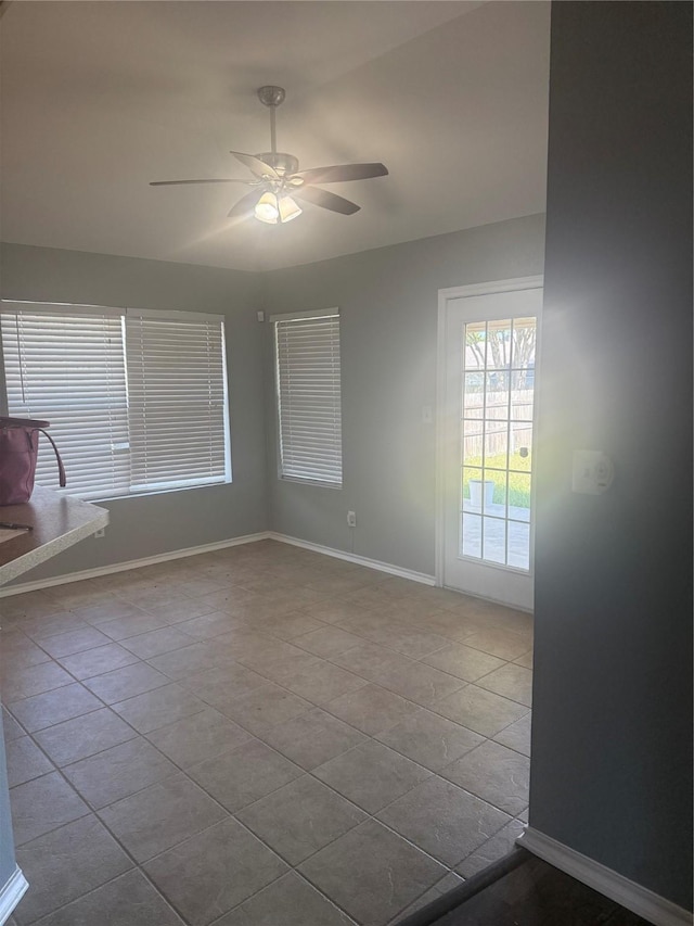 105 Wildcat Dr, Waco, TX 76705 - unfurnished room featuring a ceiling fan, tile patterned floors, and baseboards