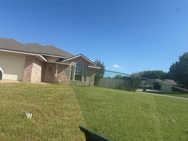 105 Wildcat Dr, Waco, TX 76705 - view of side of property with brick siding, an attached garage, and roof with shingles