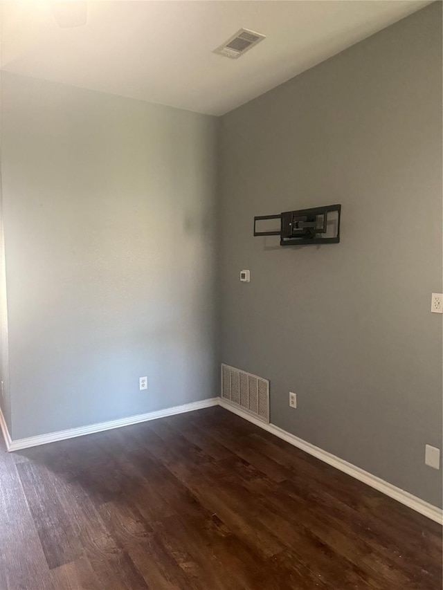 105 Wildcat Dr, Waco, TX 76705 - spare room featuring dark wood finished floors and baseboards