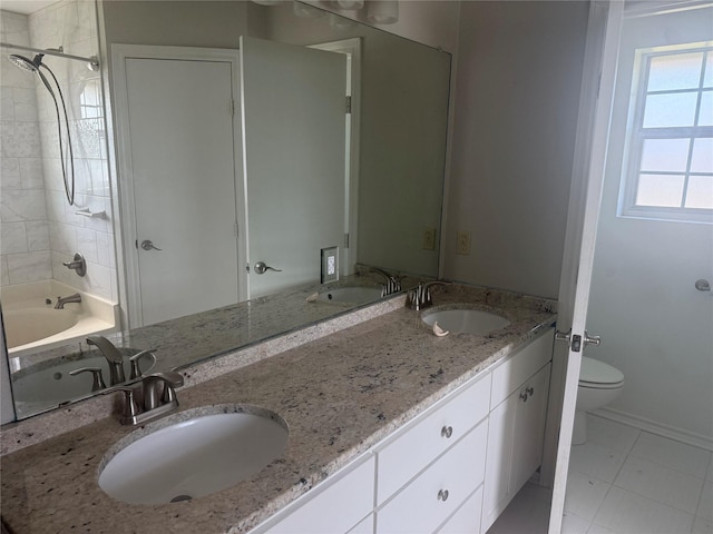 105 Wildcat Dr, Waco, TX 76705 - full bath featuring toilet, double vanity, shower / tub combination, and baseboards