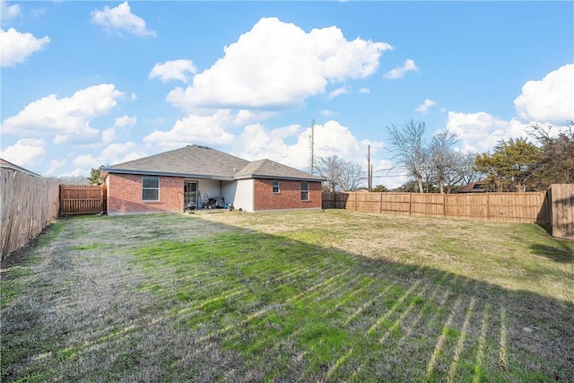 101 Hassie Ln, Waco, TX 76705 - rear view of house with brick siding and a fenced backyard