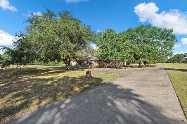 158 Old Tokio Rd, West, TX 76691 - view of home's community with a lawn and driveway