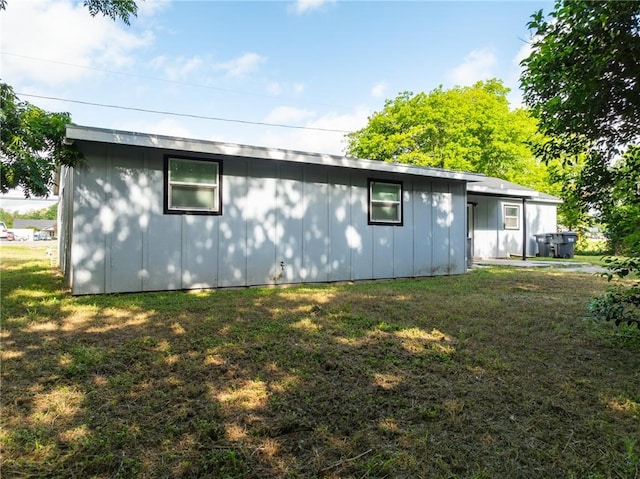 3212 Robinson Rd, Waco, TX 76706 - back of house featuring a lawn and board and batten siding