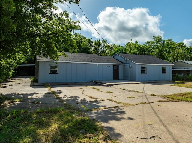 3212 Robinson Rd, Waco, TX 76706 - exterior space featuring a patio, board and batten siding, driveway, and roof with shingles