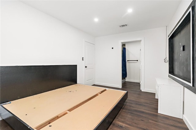 3212 Robinson Rd, Waco, TX 76706 - bedroom featuring wood finished floors, visible vents, baseboards, recessed lighting, and a walk in closet