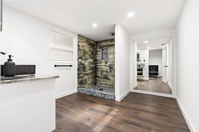 3212 Robinson Rd, Waco, TX 76706 - full bath with recessed lighting, baseboards, tiled shower, and wood finished floors