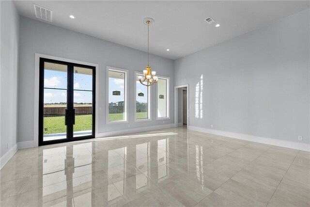 unfurnished room featuring recessed lighting, a notable chandelier, baseboards, and visible vents