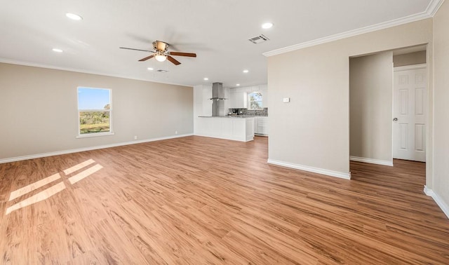 unfurnished living room featuring a ceiling fan, visible vents, light wood finished floors, baseboards, and ornamental molding