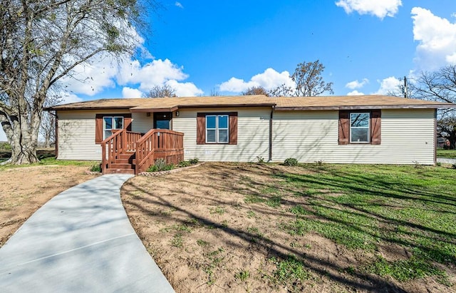 ranch-style home with a front yard