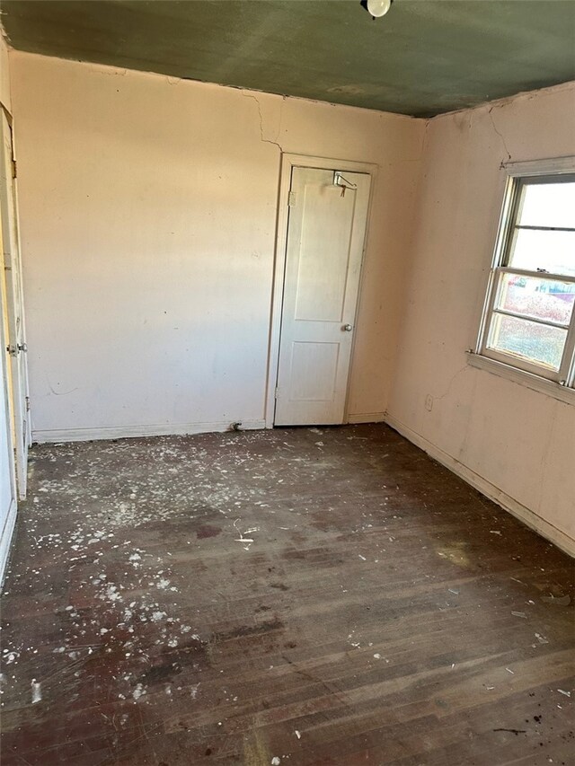 unfurnished room featuring wood finished floors