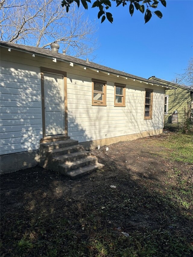 rear view of house with entry steps