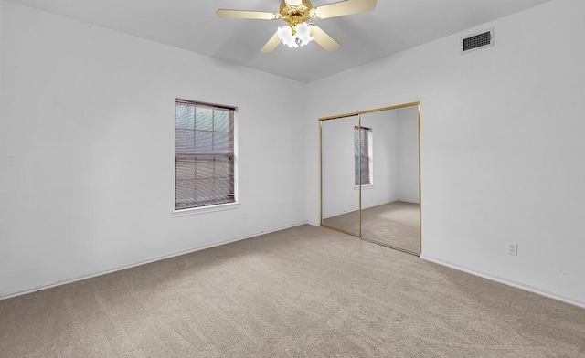 556 Old Speegleville Rd, Woodway, TX 76712 - unfurnished bedroom featuring light carpet, a closet, and ceiling fan