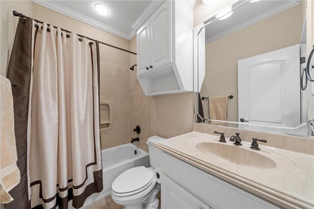 bathroom with tile patterned floors, toilet, vanity, shower / bath combo with shower curtain, and ornamental molding