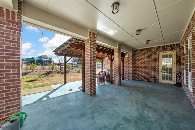 view of patio featuring fence