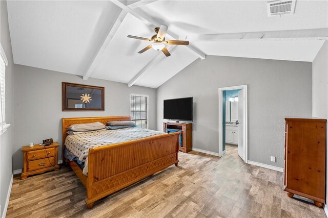 bedroom with ceiling fan, baseboards, vaulted ceiling with beams, wood finished floors, and visible vents