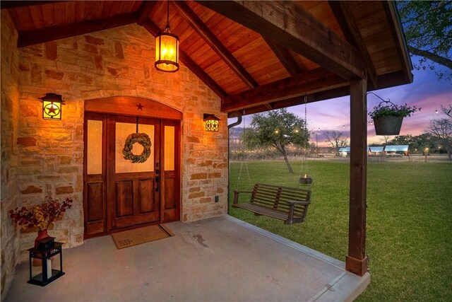 419 Rogers Hill Spur, Waco, TX 76705 - view of exterior entry with a yard and stone siding