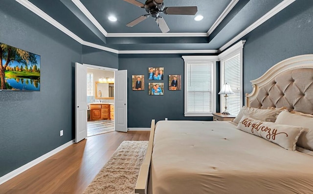 304 Chamberly Rd, Waco, TX 76712 - bedroom featuring crown molding, a tray ceiling, multiple windows, and wood finished floors