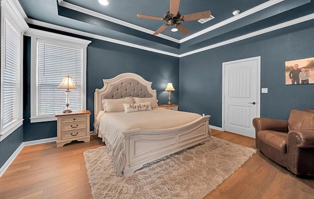 304 Chamberly Rd, Waco, TX 76712 - bedroom with crown molding, ceiling fan, a raised ceiling, baseboards, and wood finished floors