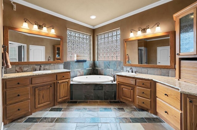 304 Chamberly Rd, Waco, TX 76712 - bathroom with a bath, crown molding, two vanities, a sink, and stone tile flooring
