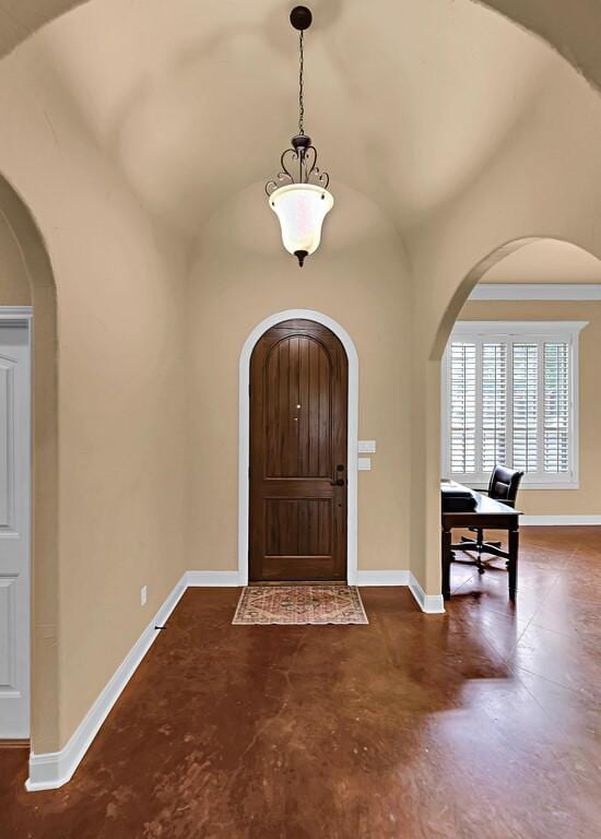 304 Chamberly Rd, Waco, TX 76712 - entrance foyer with baseboards, arched walkways, finished concrete flooring, and lofted ceiling