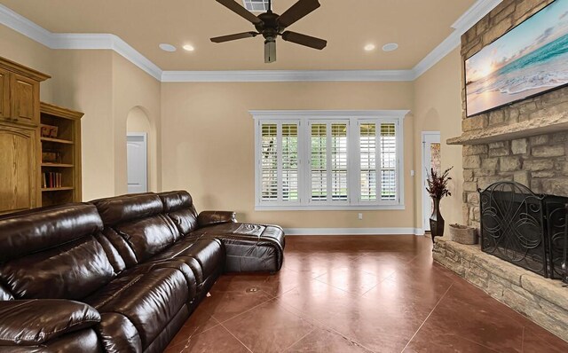 304 Chamberly Rd, Waco, TX 76712 - living room with ceiling fan, arched walkways, tile patterned flooring, a fireplace, and ornamental molding