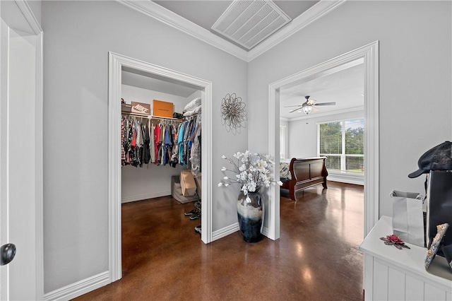 hallway featuring visible vents, baseboards, finished concrete floors, and ornamental molding