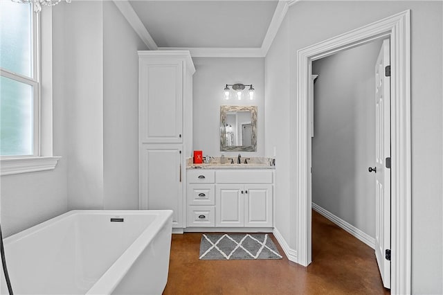full bathroom featuring finished concrete flooring, baseboards, ornamental molding, a freestanding tub, and vanity