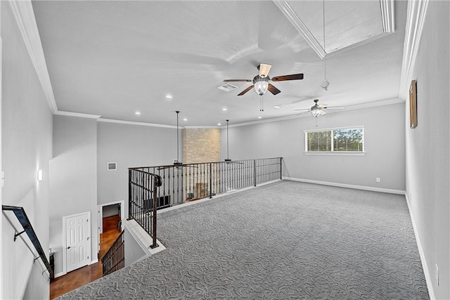 unfurnished room featuring visible vents, baseboards, attic access, ceiling fan, and dark colored carpet