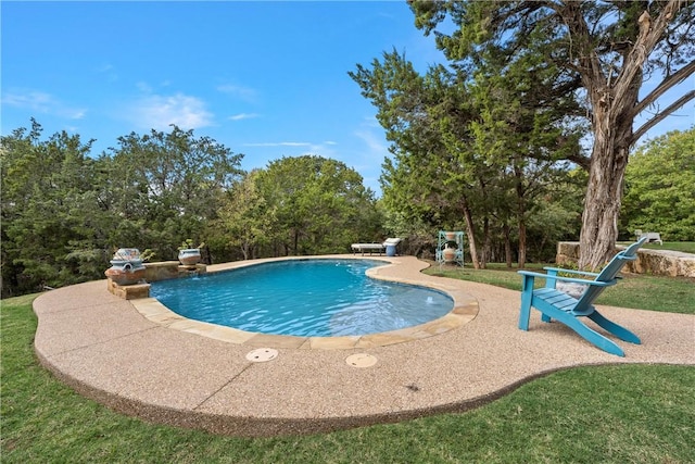 outdoor pool with a patio area