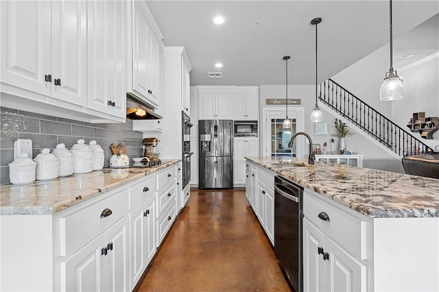 kitchen featuring a sink, tasteful backsplash, stainless steel appliances, white cabinets, and concrete flooring