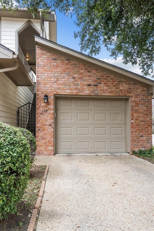 102 Pleasant Grove Ln Unit 102, Waco, TX 76712 - garage featuring concrete driveway
