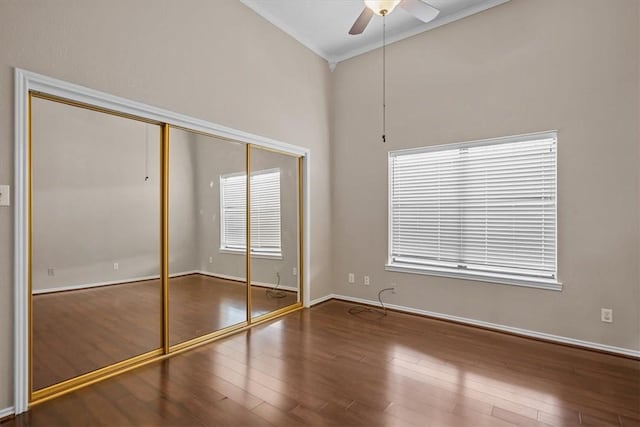 102 Pleasant Grove Ln Unit 102, Waco, TX 76712 - unfurnished bedroom featuring wood finished floors, a closet, baseboards, ceiling fan, and vaulted ceiling