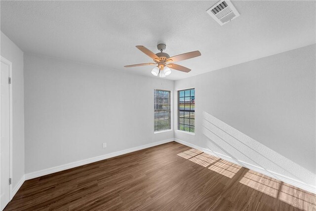 4617 Anlo St, Waco, TX 76710 - bathroom with wood finished floors, a stall shower, vanity, and a textured wall