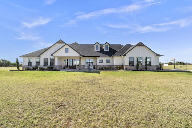 1215 Ropers Alley Rd, Belton, TX 76513 - view of front of house featuring a front yard, board and batten siding, and roof with shingles