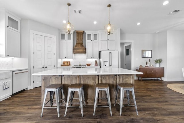 1215 Ropers Alley Rd, Belton, TX 76513 - kitchen featuring dishwasher, visible vents, high end fridge, and premium range hood