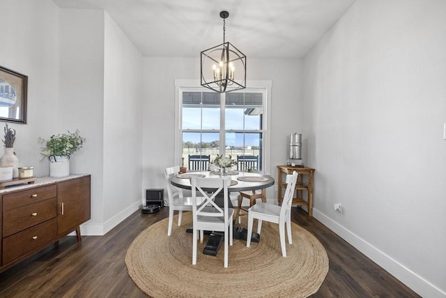 1215 Ropers Alley Rd, Belton, TX 76513 - dining room with baseboards, dark wood-type flooring, and an inviting chandelier