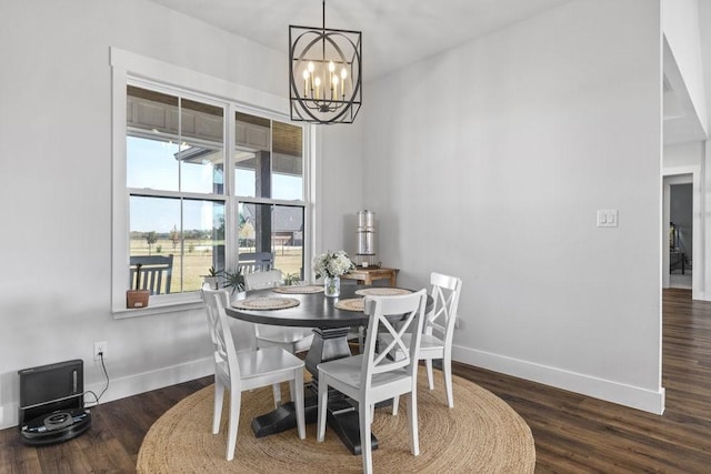 1215 Ropers Alley Rd, Belton, TX 76513 - dining area with baseboards, an inviting chandelier, and wood finished floors