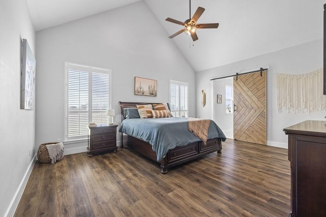 1215 Ropers Alley Rd, Belton, TX 76513 - bedroom featuring a barn door, multiple windows, high vaulted ceiling, and dark wood finished floors