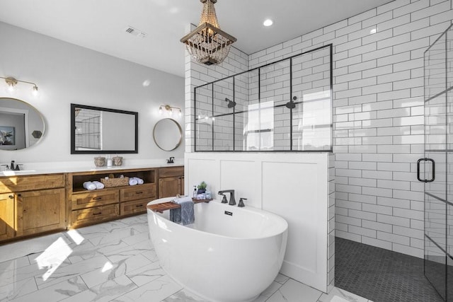 1215 Ropers Alley Rd, Belton, TX 76513 - full bath with a freestanding tub, visible vents, marble finish floor, a sink, and a shower stall